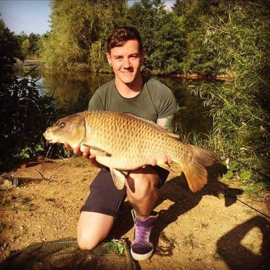 Thomas Cooper with one of his recent catches of a 20lb Common Carp from Heritage Lake